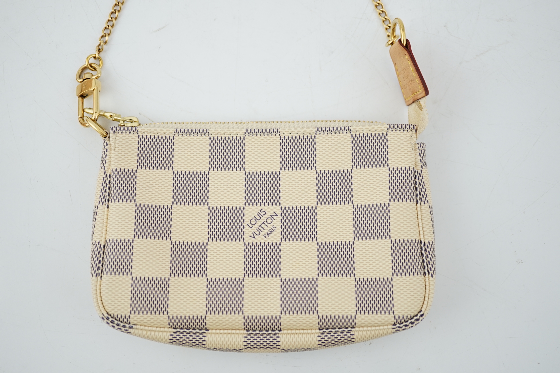 A Louis Vuitton white check mini handbag, height 10cm, width 15cm